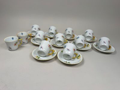 a group of cups and saucers sitting on top of a table