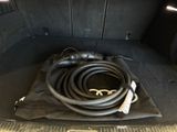 a hose in the trunk of a car that is empty