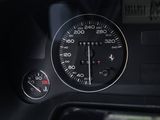a close up of a car dashboard with a speedometer