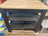 a wooden table with a shelf on top of a pallet