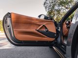 the interior of a car with the door open and the driver ' s side door open