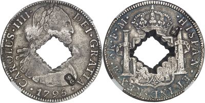 a close up of a coin with a hole in the middle of it