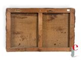 an old wooden frame with a picture of a man and a woman on it