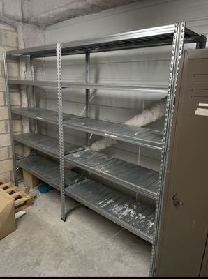 many shelves in a room with a lot of items