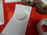 a remote control sitting on a table next to other items