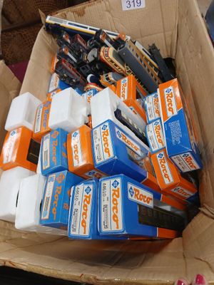 a cardboard box filled with many different types of batteries