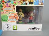 two animal crossing figurines in the box