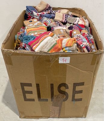 a cardboard box full of socks and socks with the word elise written on it