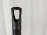 a black handle on a wooden stick on a white background
