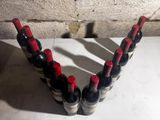 several bottles of wine are arranged in a row on a table