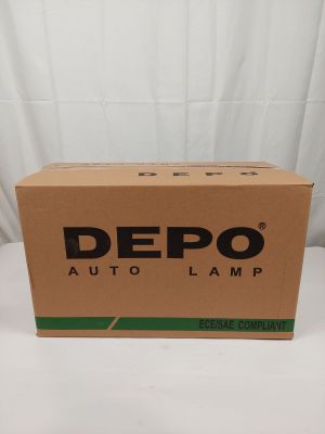 une boîte de lampes Depo Auto posée sur une table