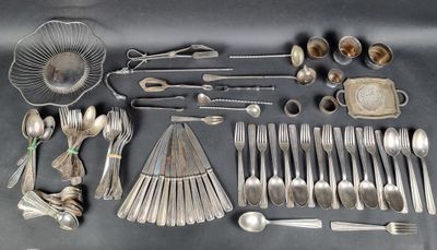 a lot of silver spoons and spoons on the table