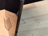 a laptop computer sitting on top of a wooden table