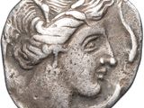 a close up of a coin with a woman ' s face on it