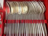 silverware in a red case with red handles and handles