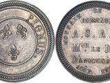 a close up of a silver coin with a picture of a man on it