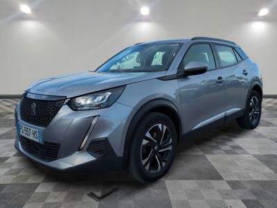 a grey 2021 nissan c - hr suv parked in a garage