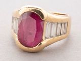 an oval ruby and diamond ring