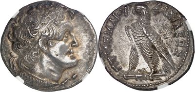 a silver coin with an image of a woman and a bird on it