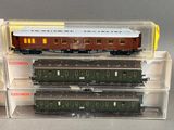 three model trains are stacked on top of each other in a display case