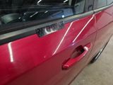a close up of a car door handle with a sticker on it
