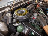 a close up of a car engine with its hood open