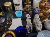 a table with a lot of antique items on it