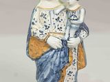 a figurine of a woman holding a child