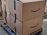 boxes on a pallet in a warehouse with a fan in the background