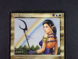a picture of a card with a picture of a woman holding a scythe