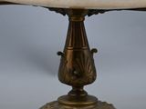 an image of a white marble pedestal with a gold base