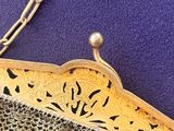 a purse that has a chain on it