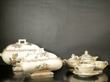 three different types of teapots and saucers on a table