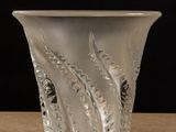 a glass vase that is sitting on a table