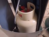 a gas bottle that is sitting in the middle of a table