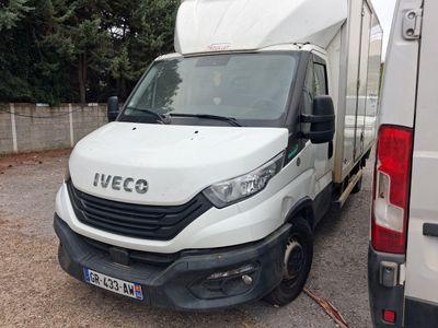 a white van that is parked next to a white van