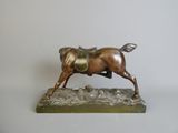 bronze statue of a horse with a saddle on it ' s back