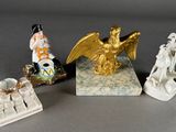 four figurines that are sitting on a table