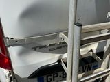 a white van parked on the side of the road