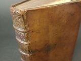 a small brown book that is sitting on a table