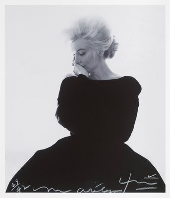 an image of a black and white photo of a woman in a dress