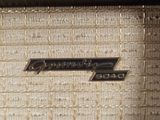 a close up of the emblem on the side of an old radio
