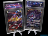 two pokemon trading cards in plastic holders on a black background