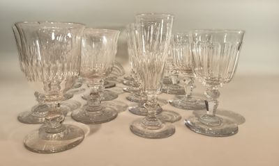 several empty wine glasses sitting on a table with a white background
