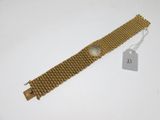 a close up of a wrist watch with a tag on it