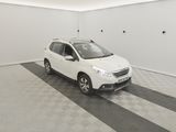 the small white car is parked in the garage of the house