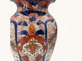 a vase with a lid on a white background