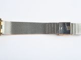 an image of a close up of a wrist watch on a white surface