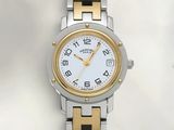 an image of a close up of a wrist watch on a white surface