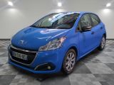 a blue car is parked in a room with a checkered floor
